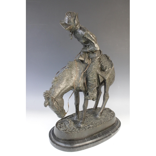 117 - After Frederic Remmington (American, 1861-1909), 'The Norther', a patinated bronze figural group mod... 