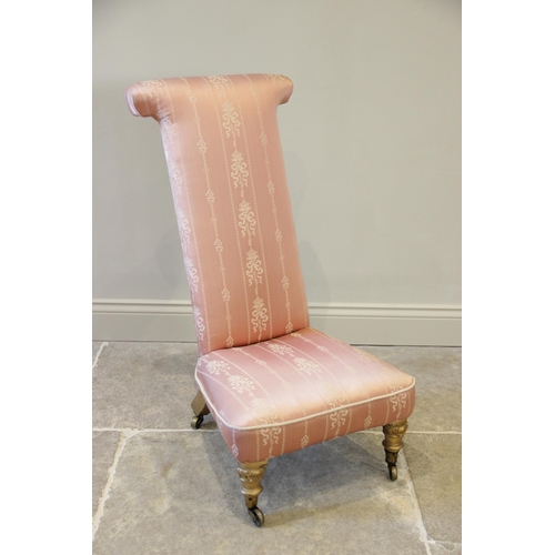 586 - A Victorian prie dieu chair, of typical high back form, covered in satin fabric and raised upon gilt... 