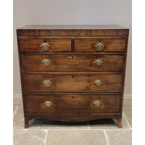 583 - An early 19th century mahogany chest of drawers, the rectangular crossbanded top above an arrangemen... 