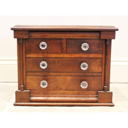 585 - A Victorian mahogany apprentice/specimen chest, in the form of a Scottish chest, with an arrangement... 