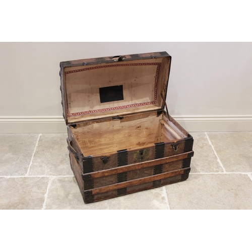 601 - A late 19th century domed steamer trunk by F A Patterson, the slatted and leather covered trunk appl... 