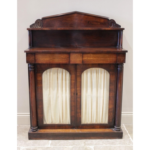 605 - A William IV rosewood chiffonier, the architectural pediment with a single shelf raised upon ring tu... 