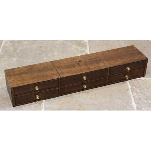 608 - An early 20th century oak desk top chest, the central hinged compartment with faux drawer moulding, ... 