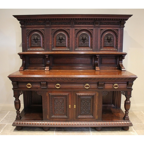 618 - A Victorian carved oak Jacobean revival buffet/sideboard, the high back with a moulded cornice over ... 