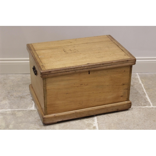 626 - A 19th century pine chest, the rectangular hinged cover opening to a fitted candle box, applied with... 