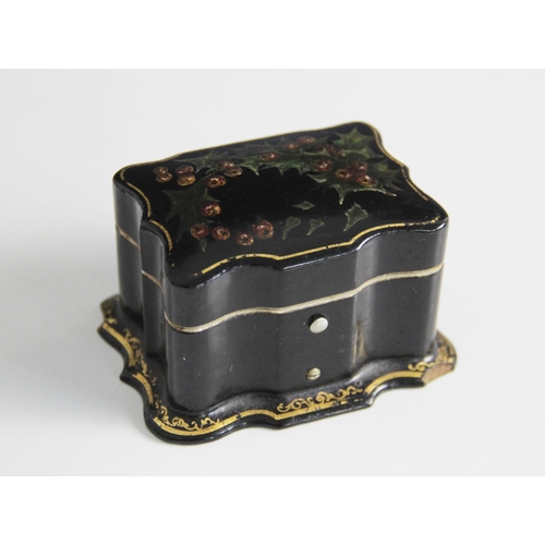 90 - A papier mache miniature casket, 19th century, the serpentine form casket decorated with holly and b... 