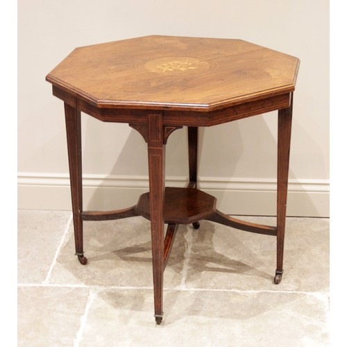 597 - A late Victorian octagonal rosewood occasional table, the top centred with inlaid foliate and musica... 