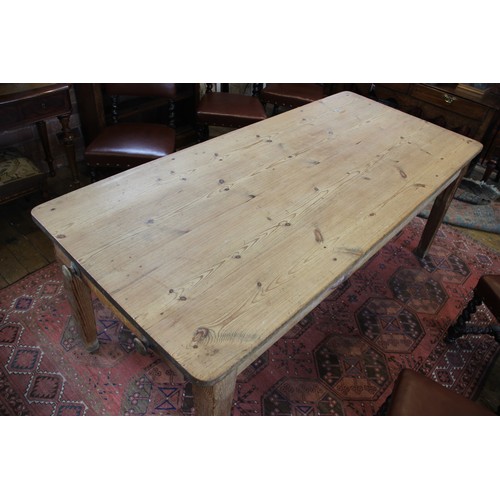 589 - A Victorian and later pine scrub top kitchen table, the rectangular table top with rounded corners o... 