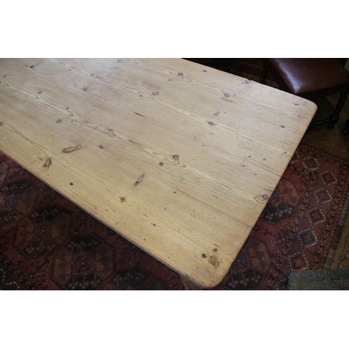 589 - A Victorian and later pine scrub top kitchen table, the rectangular table top with rounded corners o... 