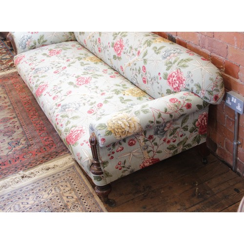 632 - A Victorian Howard type sofa, upholstered in Morris & Co 'Tangley' fabric on an eggshell ground, the... 