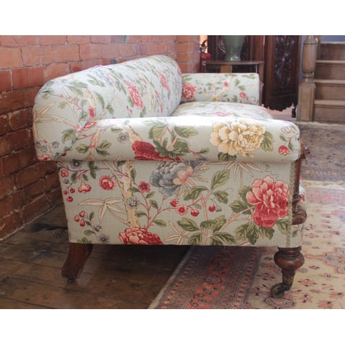 632 - A Victorian Howard type sofa, upholstered in Morris & Co 'Tangley' fabric on an eggshell ground, the... 