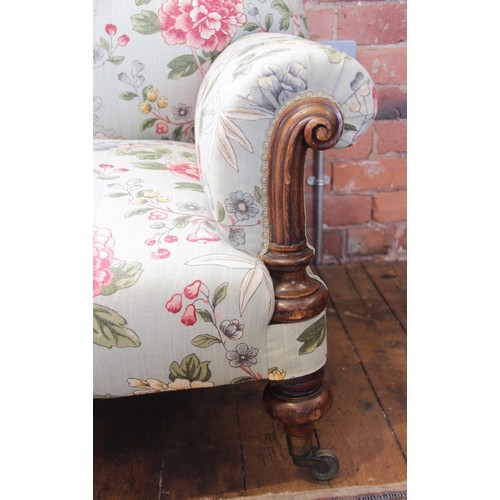 632 - A Victorian Howard type sofa, upholstered in Morris & Co 'Tangley' fabric on an eggshell ground, the... 