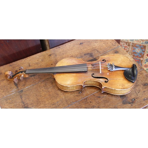 113 - A violin, 19th century with later additions and modifications, the 27cm long body with two piece bac... 