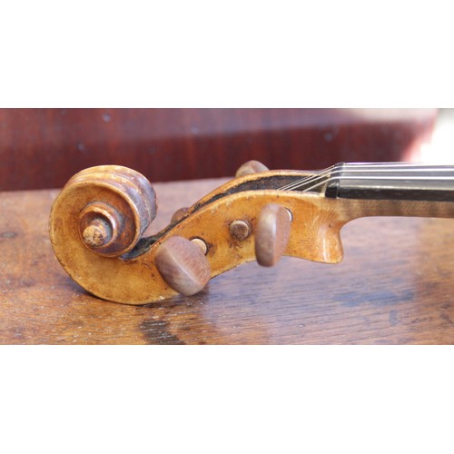 113 - A violin, 19th century with later additions and modifications, the 27cm long body with two piece bac... 