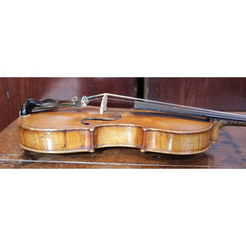 113 - A violin, 19th century with later additions and modifications, the 27cm long body with two piece bac... 