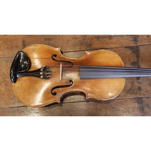 113 - A violin, 19th century with later additions and modifications, the 27cm long body with two piece bac... 