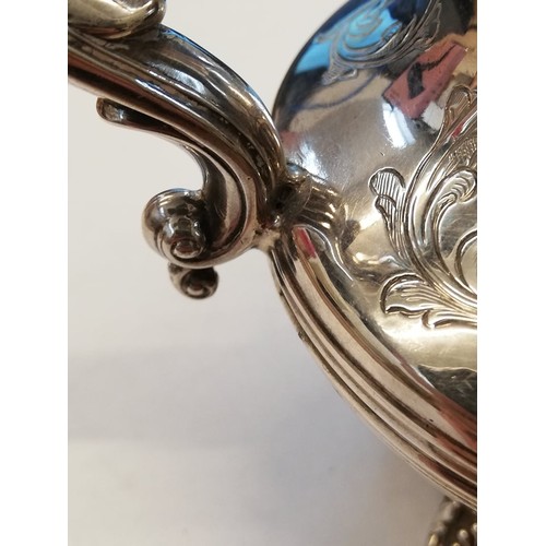 50 - A Victorian silver milk jug, Richard Pearce & George Burrows, London 1843, of baluster form on four ... 