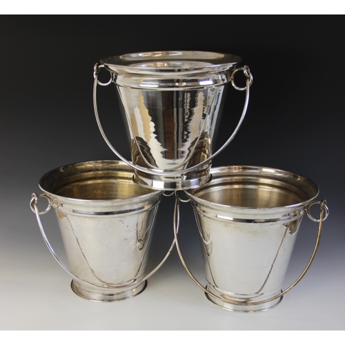 113 - Three large silver plated champagne buckets, each of tapering form with loop handles, each 49cm high