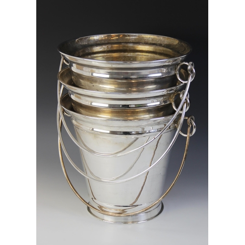 113 - Three large silver plated champagne buckets, each of tapering form with loop handles, each 49cm high