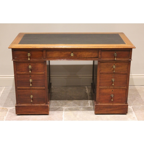 1175 - An Edwardian mahogany twin pedestal desk, the leather inset skiver above an arrangement of nine draw... 