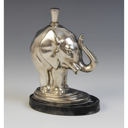 119 - A silver plated table lighter in the form of an elephant, 12.7cm high (at fault)