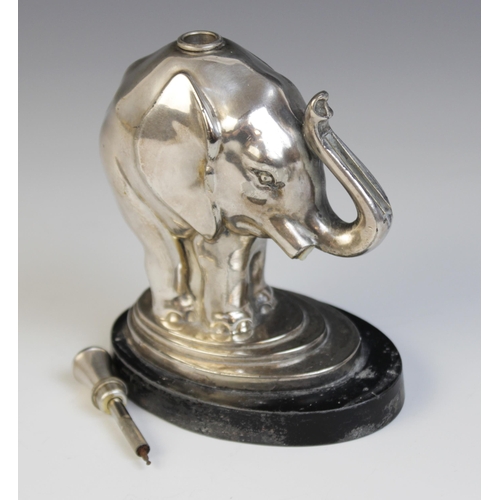 119 - A silver plated table lighter in the form of an elephant, 12.7cm high (at fault)