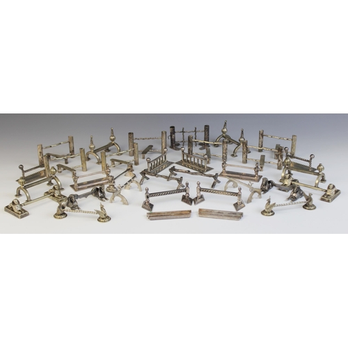 127 - A collection of 19th century and later novelty cutlery rests, including a pair of stylized thistle e... 