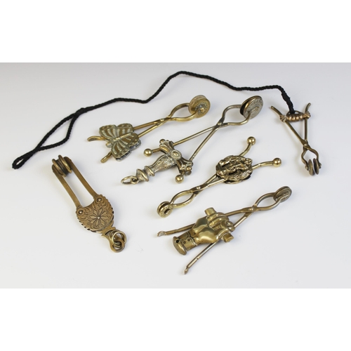 130 - Six assorted Victorian brass skirt lifters, including a butterfly example marked ‘March 19th 1877, 1... 