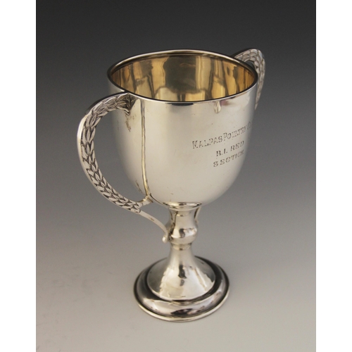 4 - A silver coloured twin-handled trophy cup, marks for James Walter Tiptaft, the plain polished bowl o... 