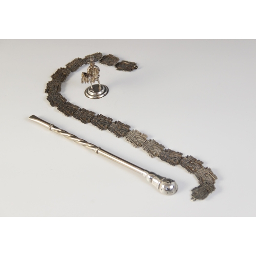 80 - An Asian silver coloured belt, comprising cast links, each designed as a figure in an architectural ... 