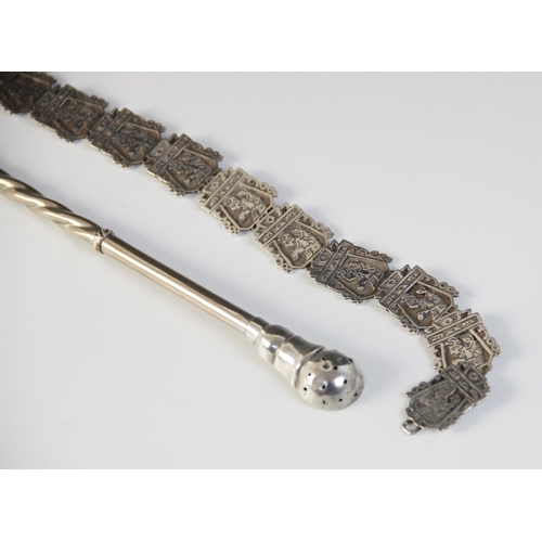 80 - An Asian silver coloured belt, comprising cast links, each designed as a figure in an architectural ... 