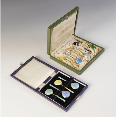 89 - A cased set of six Danish enamelled silver gilt coffee spoons by Marius Hammer, each with engine tur... 