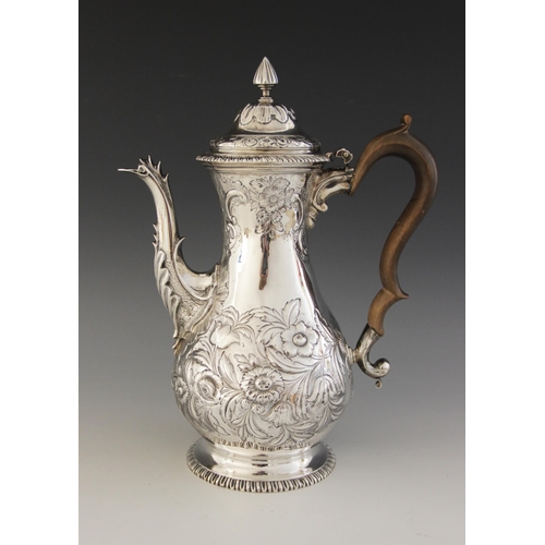 57 - A George III silver coffee pot, Francis Crump, London 1769, of baluster form on circular foot and hi... 