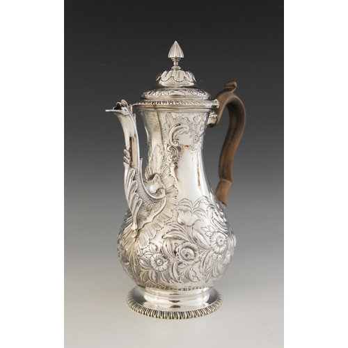57 - A George III silver coffee pot, Francis Crump, London 1769, of baluster form on circular foot and hi... 