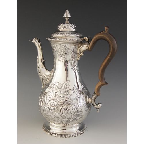 57 - A George III silver coffee pot, Francis Crump, London 1769, of baluster form on circular foot and hi... 