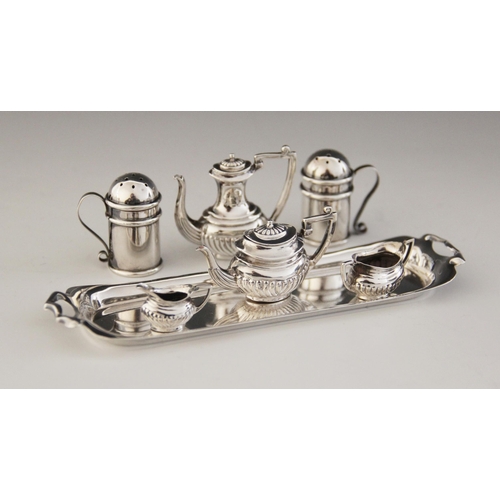 61 - A miniature silver tea service, John Rose, Birmingham 1956, comprising teapot, hot water jug, milk j... 