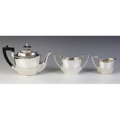 67 - A Victorian three-piece bachelor's tea service, Walker & Hall, Sheffield 1892-93, comprising teapot,... 