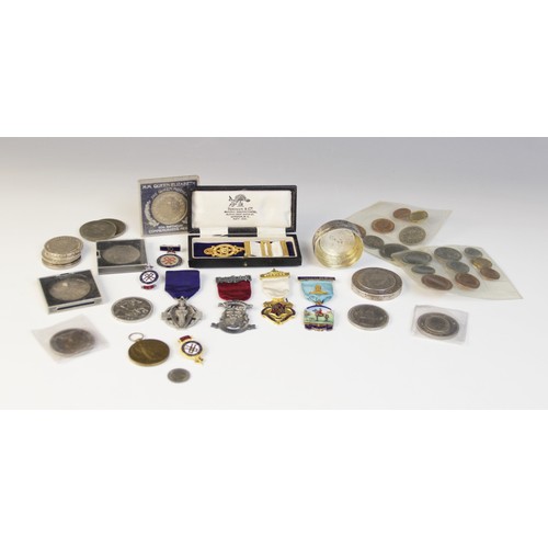26 - A selection of coins and medallions, to include a silver box inset with European coins, assorted sil... 