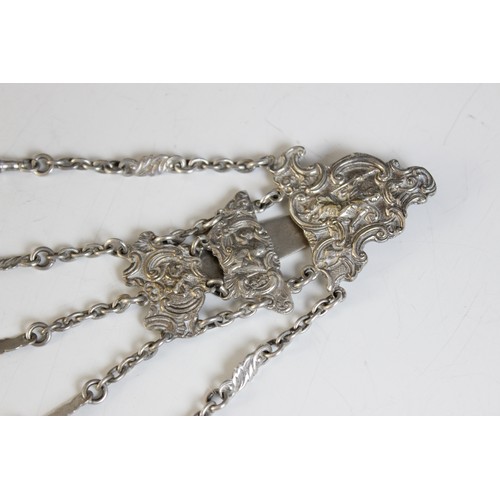 107 - A Victorian silver plated chatelaine, the scrolling mount with five graduated chains, maximum length... 