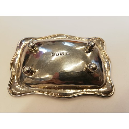 104 - A George V silver pin dish, Omar Ramsden, London 1922, of rectangular form with shaped borders on fo... 