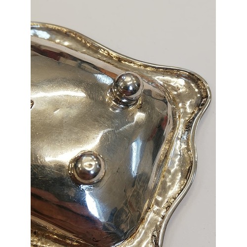 104 - A George V silver pin dish, Omar Ramsden, London 1922, of rectangular form with shaped borders on fo... 