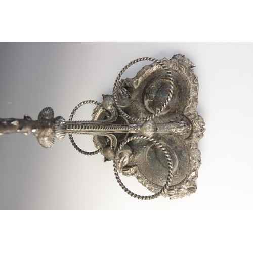 109 - A late 19th century silver plated triple decanter stand, trefoil base with cast rim and shell feet, ... 