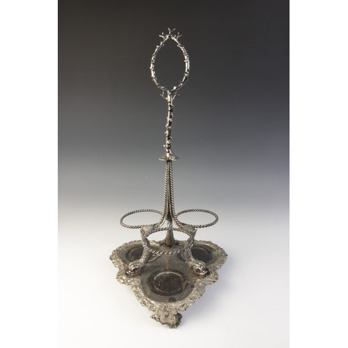 109 - A late 19th century silver plated triple decanter stand, trefoil base with cast rim and shell feet, ... 