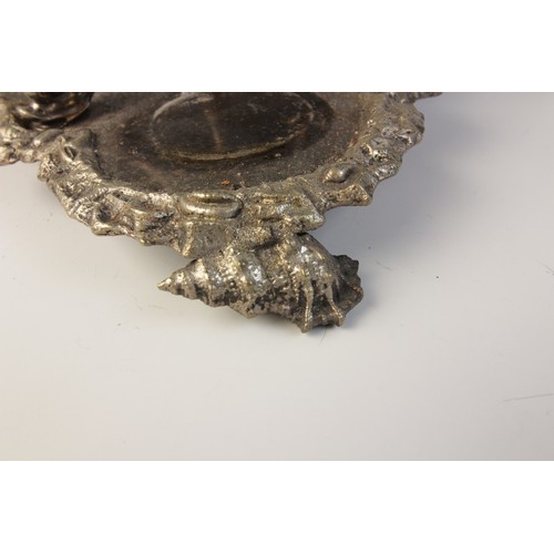 109 - A late 19th century silver plated triple decanter stand, trefoil base with cast rim and shell feet, ... 