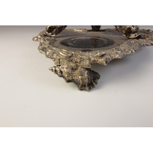 109 - A late 19th century silver plated triple decanter stand, trefoil base with cast rim and shell feet, ... 