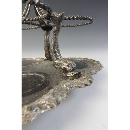 109 - A late 19th century silver plated triple decanter stand, trefoil base with cast rim and shell feet, ... 