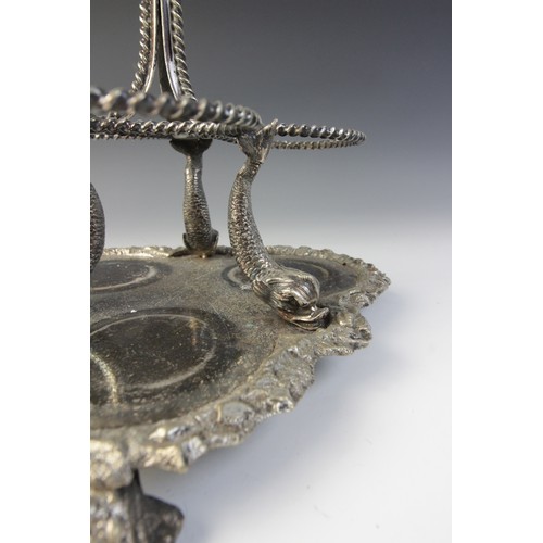 109 - A late 19th century silver plated triple decanter stand, trefoil base with cast rim and shell feet, ... 