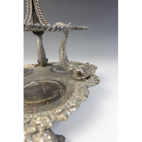 109 - A late 19th century silver plated triple decanter stand, trefoil base with cast rim and shell feet, ... 