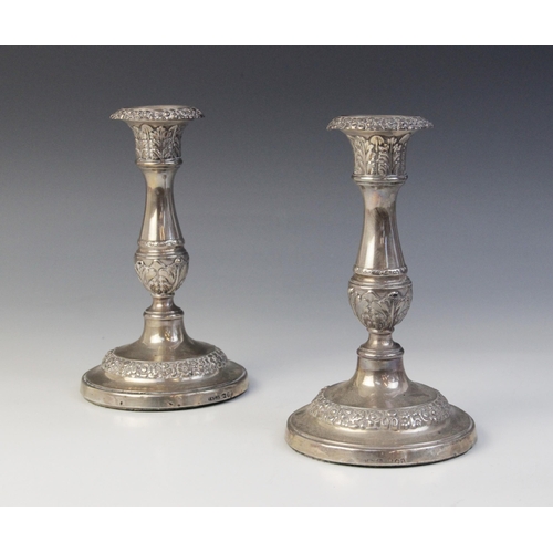 1 - A pair of George IV silver candlesticks, John & Thomas Settle, Sheffield 1823, baluster stems on wei... 