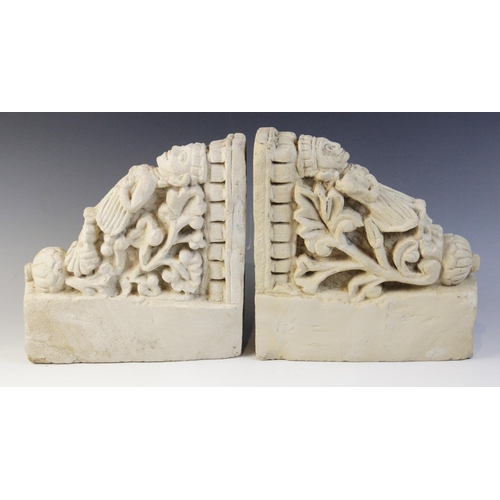 100 - A pair of carved stone brackets, each depicting a female figure in elaborate robes upon a shell and ... 